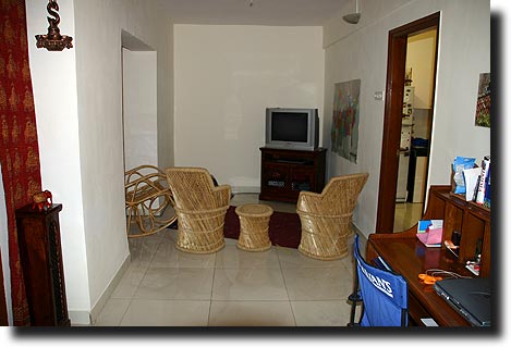 TV corner and desk, kitchen on right