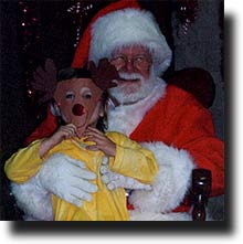 Don't leave any 'reindeer remnants' on my lap, little girl!