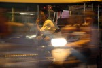 Phnom Penh rikshaw driver amid the evening's hustle and bustle