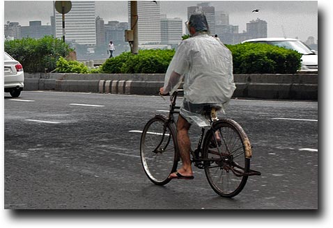 Riding a bike with the latest plastic raingear