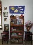 A bookcase we got in India, with a painting made by a friend there extolling the virtues of Mumbai's noise