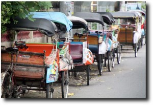 Becak cabs - pronounced "bay-chock" - lined up in Yogya. In Jakarta becaks are like Indian rickshaws, but here they are bicycle powered