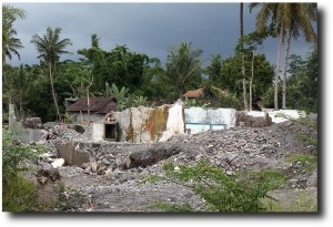 Against the dark of an approaching storm, the volcanic damage is evident