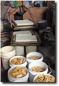 Moving the heavy racks of tofu