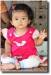 The kids along the way were just gorgeous. This little one was prompted to wave by her parents (although that sure looks like some Buddha finger positioning there).