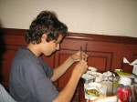 Breck demonstrates his "mastery" of chopsticks