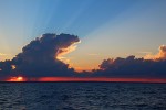 Sunset through a rainstorm on Lake Michigan