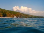 Getting ready to go under - with a Balinese fishing boat above and in the shadow of the volcano Agung.