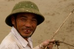 Smiling faces greeted us around the country, such as on this mud-spattered oxen-driving farmer.