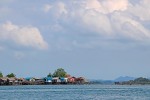 Between the water and the sky, fishing villages a built on stilts due to the varying tidal levels.