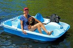 Susan plays with the labs on the paddle boat.