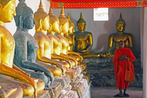Category - Open: A friendly monk among the statues at Wat Pho in Bangkok.